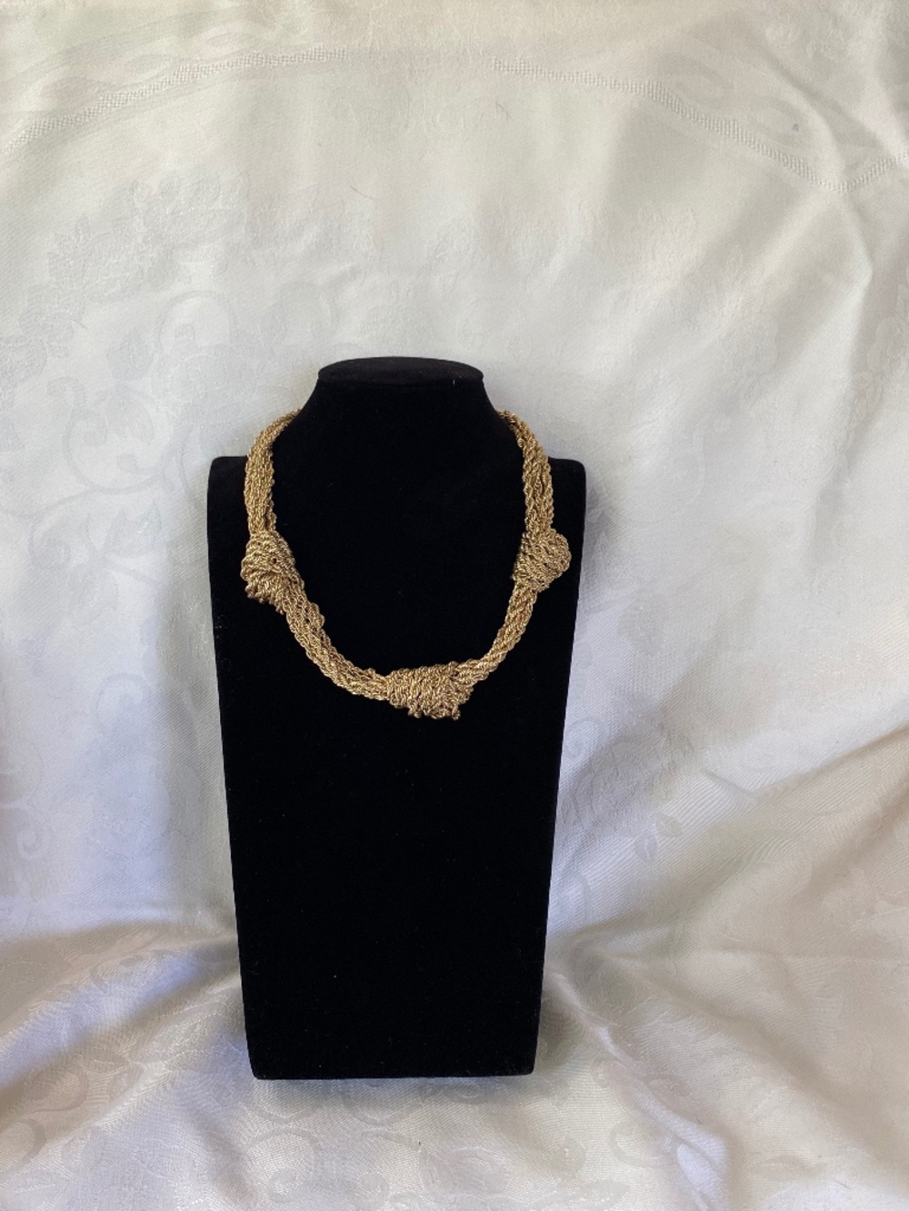 Gold Tone Multi Strand Woven Knot Statement Necklace